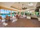 Luxurious outdoor space with a pool view, featuring seating, a kitchen, and stylish decor at 1012 Tuscany Dr, Trinity, FL 34655