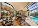 This covered patio has ample seating and is perfect for outdoor entertaining at 1012 Tuscany Dr, Trinity, FL 34655
