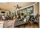 Covered patio features comfortable seating and a ceiling fan at 1012 Tuscany Dr, Trinity, FL 34655