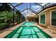 A stunning pool and jacuzzi area are enclosed in a screened enclosure for year-round enjoyment at 1012 Tuscany Dr, Trinity, FL 34655