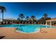 Gorgeous swimming pool and spa with inviting steps, palm trees, and comfortable seating for a luxurious outdoor experience at 1012 Tuscany Dr, Trinity, FL 34655