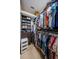 Walk-in closet featuring ample hanging space and shelving at 1012 Tuscany Dr, Trinity, FL 34655