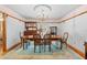 Formal dining room featuring a chandelier, hardwood floors, and a decorative rug at 10193 Wallien Dr, Brooksville, FL 34601