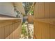 Exterior view between fences with yard equipment and an outdoor water tank at 10193 Wallien Dr, Brooksville, FL 34601
