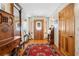 Foyer featuring hardwood floors, unique decor, and a welcoming entrance at 10193 Wallien Dr, Brooksville, FL 34601