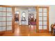 Open foyer showcasing hardwood floors, decorative mirror, and inviting entryway at 10193 Wallien Dr, Brooksville, FL 34601