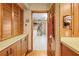 Hallway with cabinetry leading to the laundry room at 10193 Wallien Dr, Brooksville, FL 34601