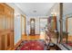 Hallway featuring hardwood floors, decorative walls, and inviting access to rooms at 10193 Wallien Dr, Brooksville, FL 34601