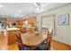 Eat-in kitchen featuring a wooden table set and vintage decor that adds character to the space at 10193 Wallien Dr, Brooksville, FL 34601