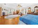 Spacious main bedroom features hardwood floors, bright windows, and comfortable seating area at 10193 Wallien Dr, Brooksville, FL 34601