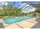 Relaxing screened pool with trees at 10193 Wallien Dr, Brooksville, FL 34601
