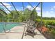 Covered patio, pool and lush landscaping at 10193 Wallien Dr, Brooksville, FL 34601