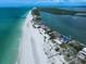 Magnificent aerial view of a coastal neighborhood with white sand beaches and serene waters at 1114 Mandalay Pt, Clearwater Beach, FL 33767