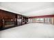 Large living room with fireplace, built-in cabinets, and views of the beach and palm trees at 1114 Mandalay Pt, Clearwater Beach, FL 33767