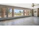 Bright sun room with tile flooring, large windows, and exterior access at 1114 Mandalay Pt, Clearwater Beach, FL 33767