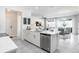 Open kitchen featuring stainless steel appliances, and a view into the living and dining areas at 11739 Blackbrook Ct, Seffner, FL 33584