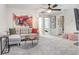 Living room with modern decor, comfortable seating, and a view into other areas of the home at 11739 Blackbrook Ct, Seffner, FL 33584