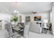 Bright living space featuring an open layout, modern decor, and stylish dining set at 11739 Blackbrook Ct, Seffner, FL 33584