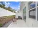 Cozy patio area with seating, perfect for enjoying the outdoor space and private fenced backyard at 11739 Blackbrook Ct, Seffner, FL 33584