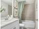 Bathroom featuring a white vanity, shower-tub combination, and modern decor at 11749 Blackbrook Ct, Seffner, FL 33584