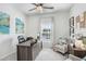Bright office with a large window, desk, comfortable seating, and stylish decor at 11749 Blackbrook Ct, Seffner, FL 33584