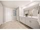 Bright bathroom featuring double sinks, modern fixtures, and a large mirror for a spa-like experience at 1182 Orlando Blvd, Port Charlotte, FL 33952