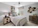 Comfortable bedroom featuring a plush bed, stylish decor, and a ceiling fan at 1182 Orlando Blvd, Port Charlotte, FL 33952