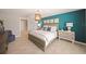 Stylish bedroom with a king bed, decorative wall art, and contemporary furnishings for a relaxing retreat at 1182 Orlando Blvd, Port Charlotte, FL 33952