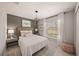 Inviting bedroom with a cozy bed, accent wall, and natural light at 1182 Orlando Blvd, Port Charlotte, FL 33952