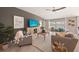 Spacious living room featuring comfortable seating, a ceiling fan, and backyard views at 1182 Orlando Blvd, Port Charlotte, FL 33952