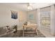 Bright home office with a modern desk, comfortable chair, and large window at 1182 Orlando Blvd, Port Charlotte, FL 33952