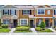 Charming townhome with colorful facade, well-maintained landscaping, and inviting entrances at 12464 Berkeley Square Dr, Tampa, FL 33626