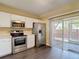 Well-equipped kitchen with stainless steel appliances and sliding glass doors to the patio at 12464 Berkeley Square Dr, Tampa, FL 33626