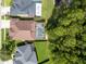 Aerial view of homes in a residential area with backyard pools, well-maintained lawns, and mature trees at 12918 Tar Flower Dr., Tampa, FL 33626