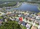 Breathtaking aerial view of homes in a tranquil community near a lake and lush green space at 12918 Tar Flower Dr., Tampa, FL 33626