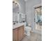 Bathroom with vanity and toilet near the patio entrance at 12918 Tar Flower Dr., Tampa, FL 33626