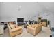 Spacious bonus room featuring comfortable seating, a large TV, and ample space for entertainment and relaxation at 12918 Tar Flower Dr., Tampa, FL 33626