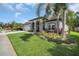 Attractive single-Gathering home featuring lush landscaping, stone accents and a well-manicured lawn at 12918 Tar Flower Dr., Tampa, FL 33626