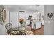 Eat-in kitchen features granite island, stainless appliances, and bright, white cabinets at 12918 Tar Flower Dr., Tampa, FL 33626