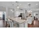 Open kitchen with island, granite countertops, stainless appliances and bar seating at 12918 Tar Flower Dr., Tampa, FL 33626