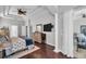 Bright main bedroom with tray ceiling, hardwood floors, large windows, and access to the lanai at 12918 Tar Flower Dr., Tampa, FL 33626