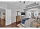 Comfortable main bedroom with hardwood floors, tray ceiling, generous closet space and ceiling fan at 12918 Tar Flower Dr., Tampa, FL 33626