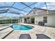 Beautiful screened-in pool with spa and spacious patio, ideal for outdoor relaxation and entertainment at 12918 Tar Flower Dr., Tampa, FL 33626
