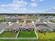 Aerial perspective highlights residences with lawns bordered by white fencing at 13235 Palmerston Rd, Riverview, FL 33579