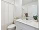 Bright bathroom featuring a vanity with white marble countertop and sleek modern faucet at 13235 Palmerston Rd, Riverview, FL 33579