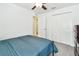 Bedroom featuring a comfortable bed, carpet floors and bi-fold closet doors at 13235 Palmerston Rd, Riverview, FL 33579