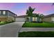 Charming single-Gathering home with a well-maintained lawn and a two-car garage with beautiful landscaping at 13235 Palmerston Rd, Riverview, FL 33579