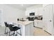 Bright and modern kitchen with a large island, stainless steel appliances, and white cabinets offering ample storage at 13235 Palmerston Rd, Riverview, FL 33579