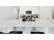 Modern kitchen with a large quartz island, stainless steel appliances, and ample cabinet space for storage at 13235 Palmerston Rd, Riverview, FL 33579