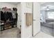 Convenient walk-in closet with clothing and shoes, connected to a bedroom for easy access and organization at 13235 Palmerston Rd, Riverview, FL 33579